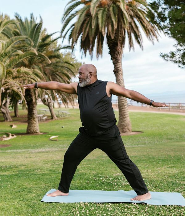 Person meditating peacefully in a natural setting.